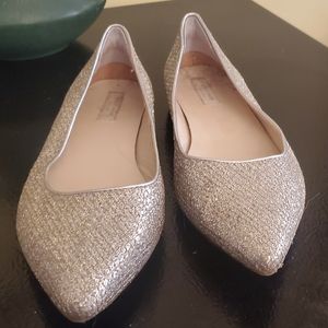 Sparkly gold Cole Haan flats with pointed toe